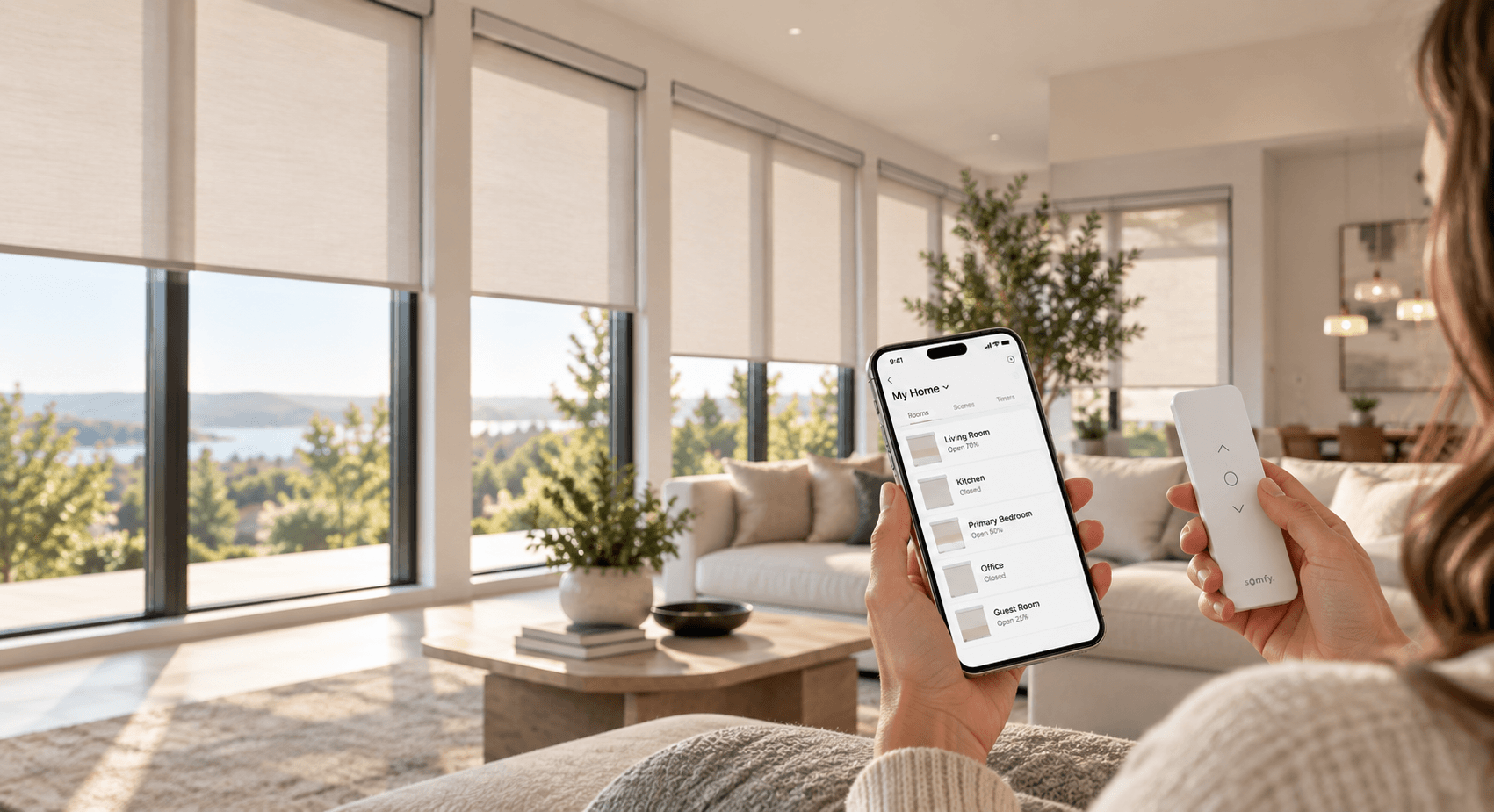 Hand holding a phone with a shade-control app